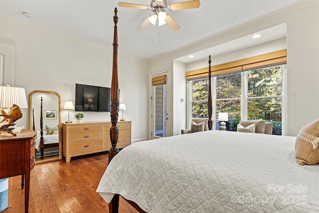 bedroom with ceiling fan, dark hardwood / wood-style flooring, and crown molding