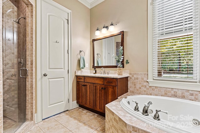 bathroom with plus walk in shower, vanity, tile patterned floors, and crown molding