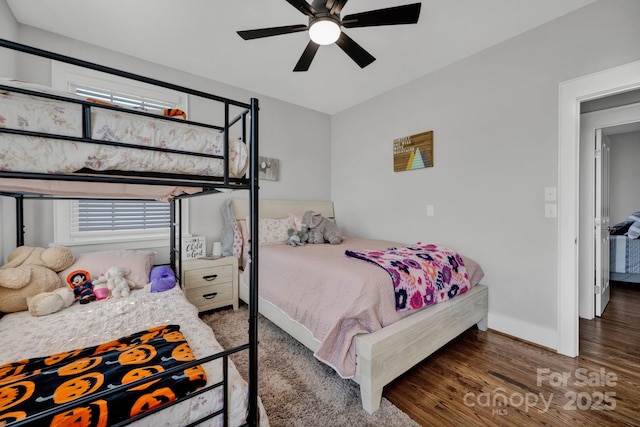 bedroom featuring dark hardwood / wood-style flooring and ceiling fan