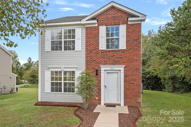 view of property with a front lawn