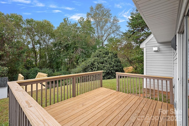 deck featuring a lawn