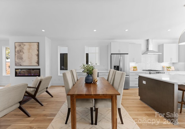 dining space featuring light hardwood / wood-style flooring