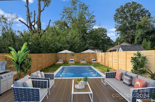 view of pool featuring an outdoor living space and a deck