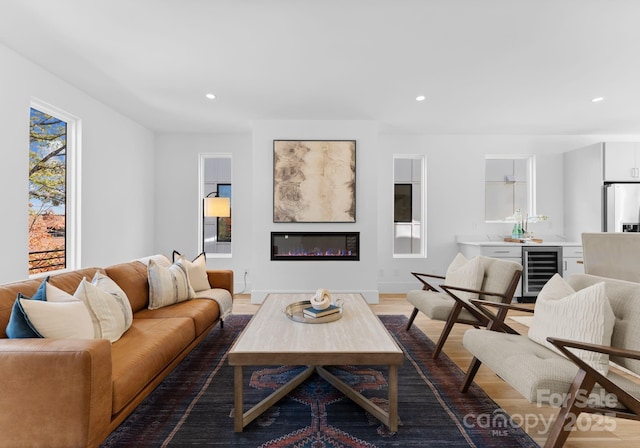 living room featuring wine cooler and dark wood-type flooring