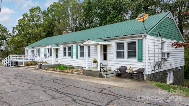 720A-C Harris Ave NW, Valdese, NC 28690 - view of front facade with a chimney and metal roof