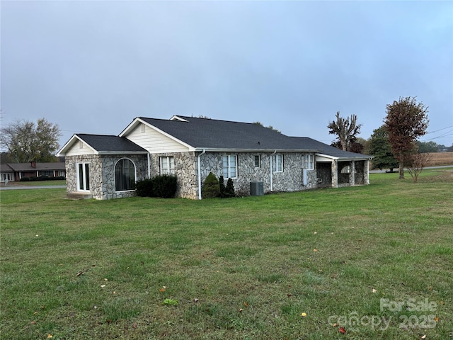 view of property exterior with a yard and central AC