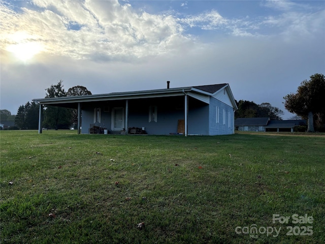 back of property with a yard