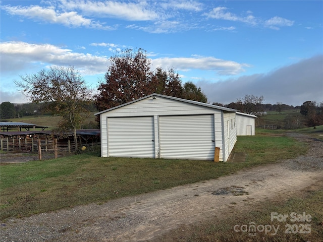 garage featuring a yard