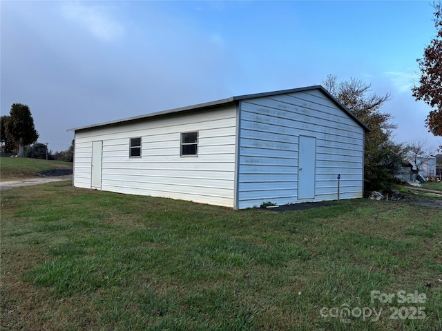 view of outdoor structure with a lawn