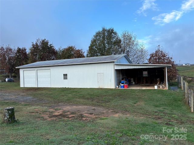 view of outdoor structure featuring a yard