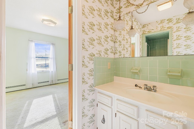 bathroom with vanity and baseboard heating