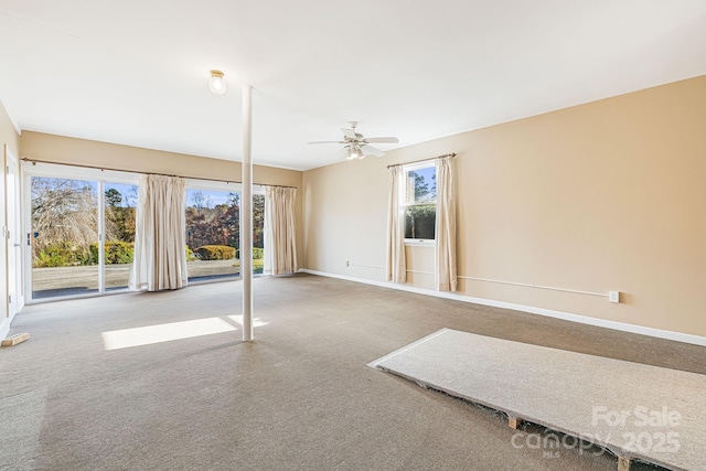 carpeted empty room featuring ceiling fan