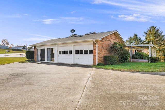 view of home's exterior featuring a garage and a yard