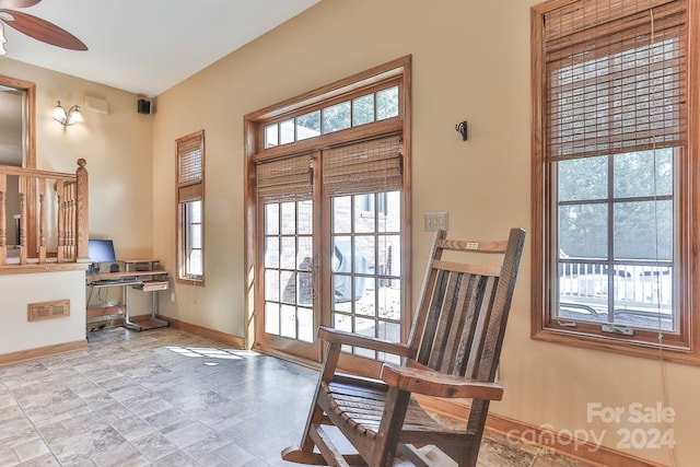 doorway to outside featuring ceiling fan