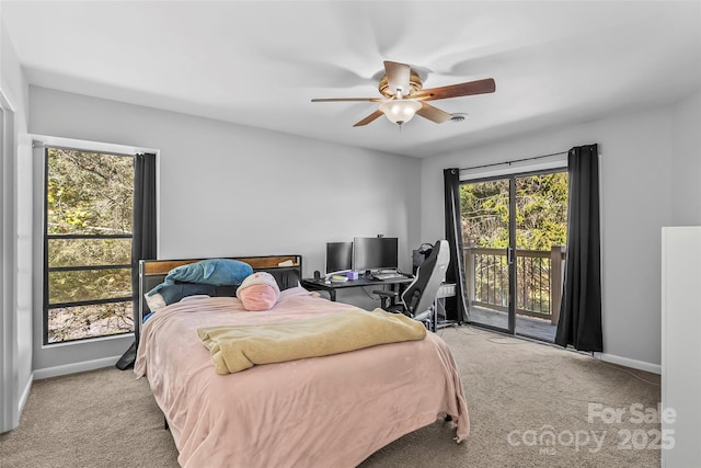 bedroom featuring ceiling fan, light colored carpet, multiple windows, and access to outside