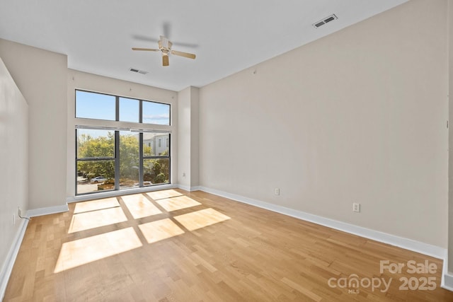 unfurnished room with ceiling fan and light hardwood / wood-style floors