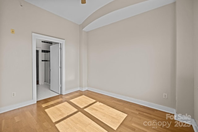 empty room featuring hardwood / wood-style flooring and ceiling fan