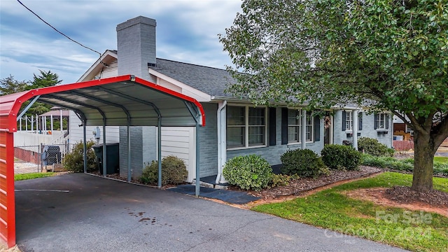 view of car parking with a carport