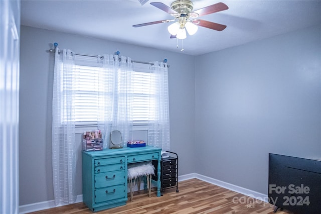 office space featuring light hardwood / wood-style flooring and ceiling fan