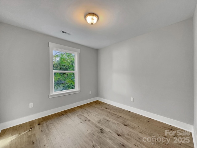 spare room featuring hardwood / wood-style flooring