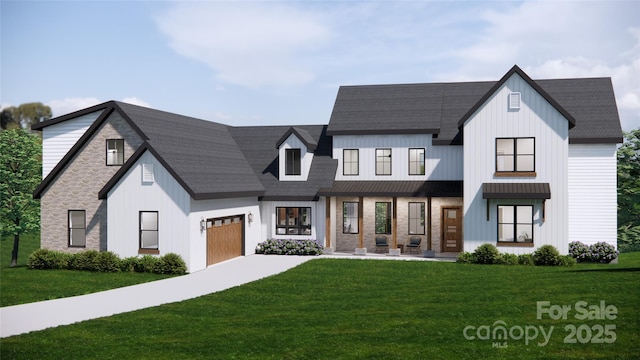 modern farmhouse featuring a front lawn and a garage