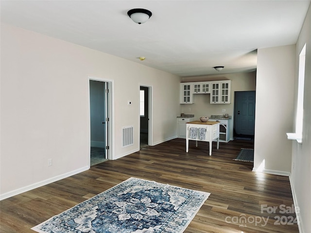 dining space featuring dark hardwood / wood-style floors