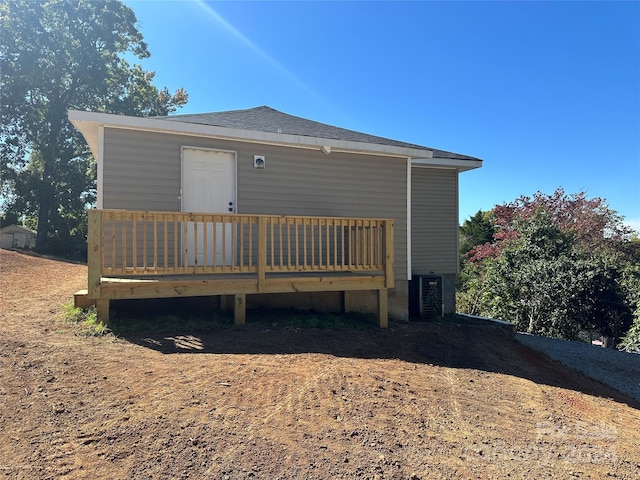 rear view of property featuring a deck