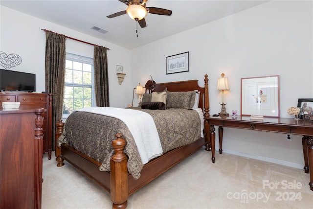 carpeted bedroom with ceiling fan