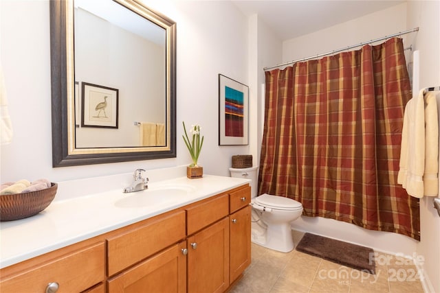 full bathroom with vanity, shower / bath combo, toilet, and tile patterned floors