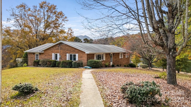 ranch-style home with a front yard