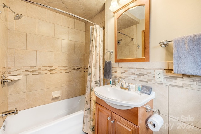 bathroom with vanity, shower / bath combo, and backsplash