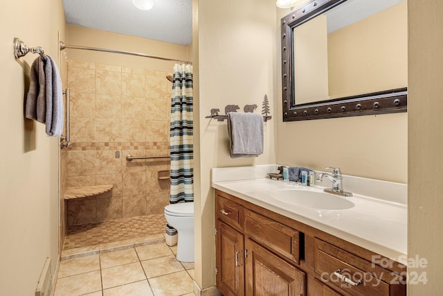 bathroom featuring a textured ceiling, toilet, vanity, a shower with curtain, and tile patterned flooring