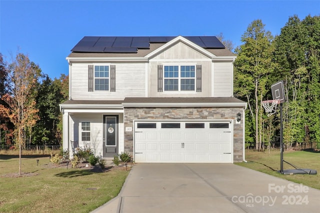 view of front of house with solar panels, a front lawn, and a garage