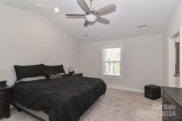 bedroom featuring ceiling fan, light carpet, and lofted ceiling