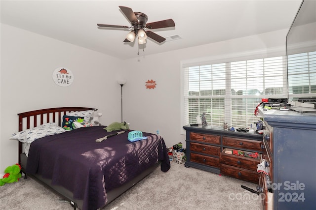 carpeted bedroom featuring ceiling fan