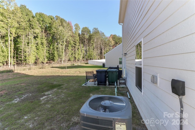 view of yard with a patio area and central AC unit