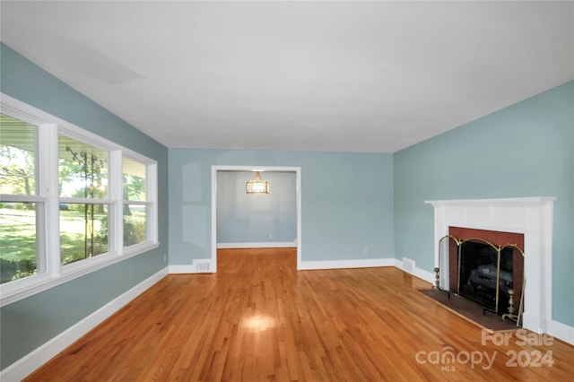 unfurnished living room with light hardwood / wood-style floors