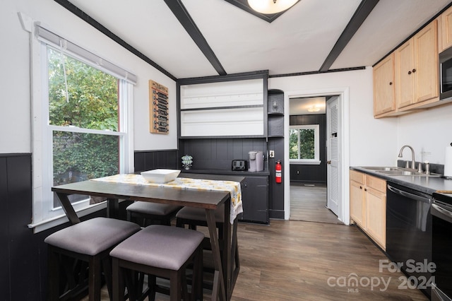 kitchen with dishwasher, sink, dark wood-type flooring, and light brown cabinetry