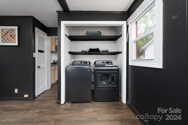 washroom featuring dark wood-type flooring and independent washer and dryer