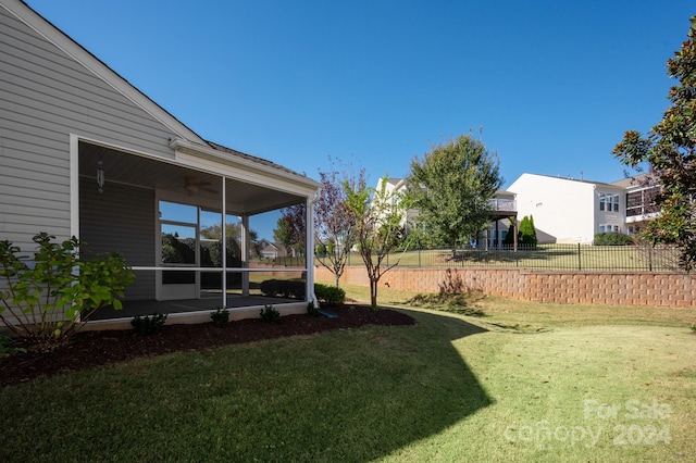 view of yard with a sunroom