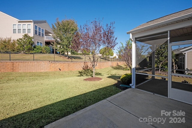 view of yard with a sunroom