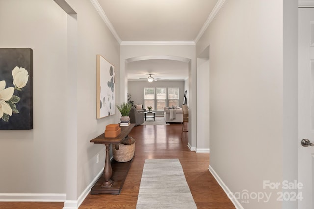 hall with hardwood / wood-style floors and crown molding