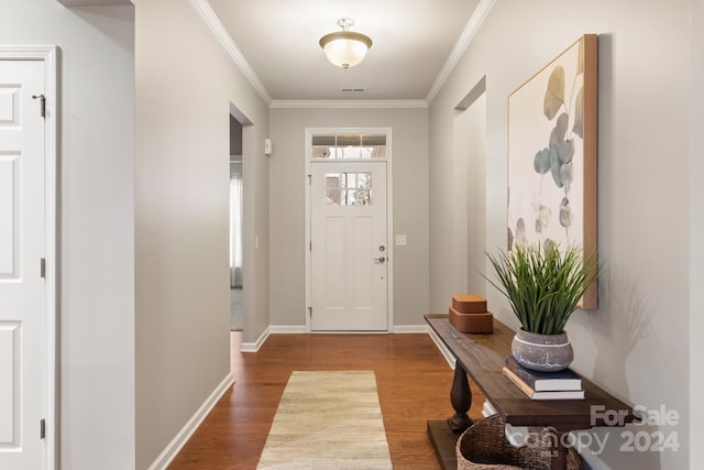 entrance foyer featuring hardwood / wood-style floors and ornamental molding