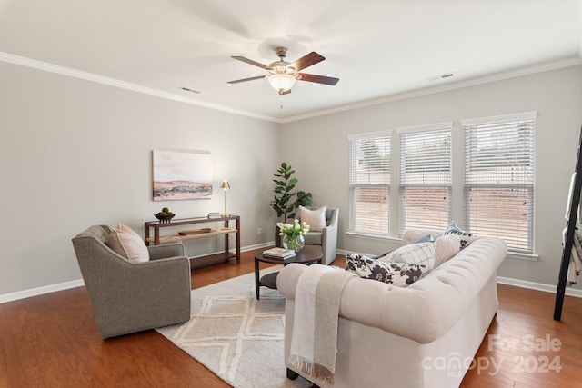 living room with ceiling fan, wood-type flooring, and ornamental molding