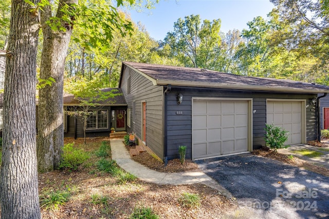 garage featuring wood walls