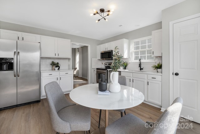 dining room featuring hardwood / wood-style flooring and sink