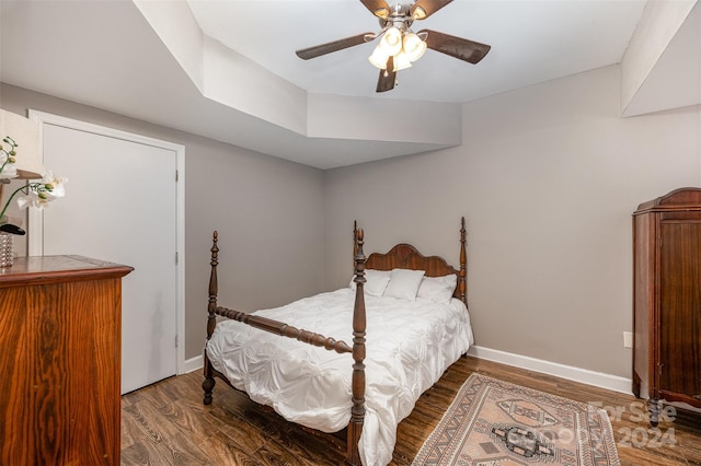 bedroom featuring ceiling fan and dark wood-type flooring