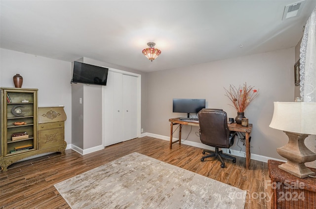 office space with dark wood-type flooring