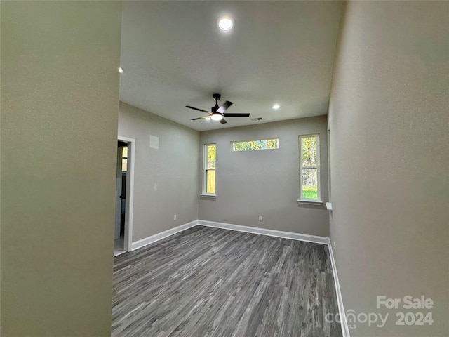 spare room with ceiling fan and hardwood / wood-style floors