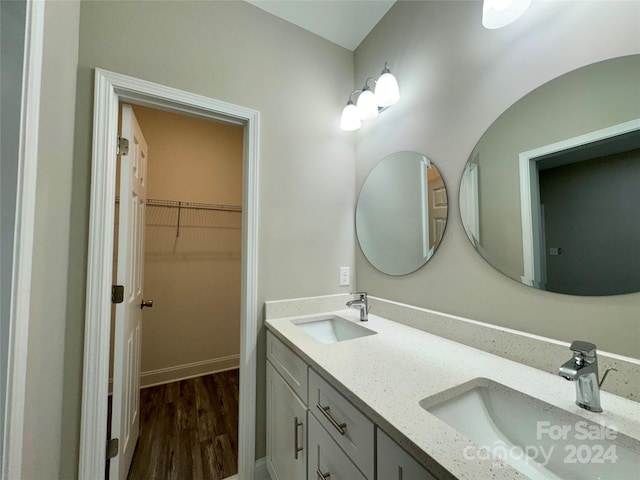 bathroom with vanity and hardwood / wood-style floors